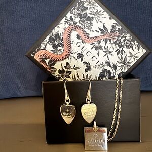Gucci Silver heart earrings, and a silver pendant necklace. SET